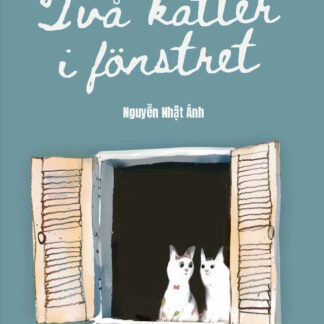 Två katter i fönstret